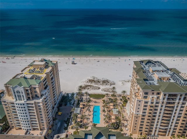 bird's eye view featuring a water view and a view of the beach