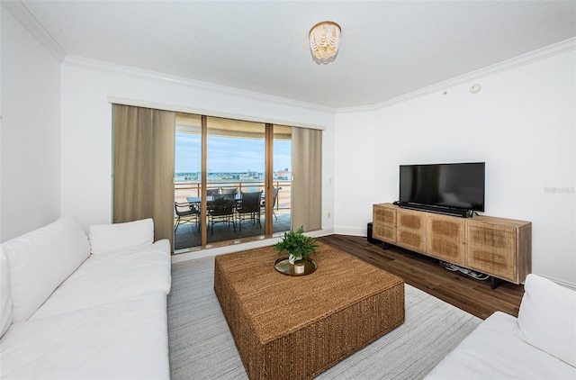 living room featuring a water view, ornamental molding, and dark hardwood / wood-style flooring