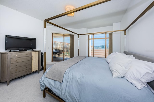 bedroom featuring ceiling fan, access to exterior, and light colored carpet