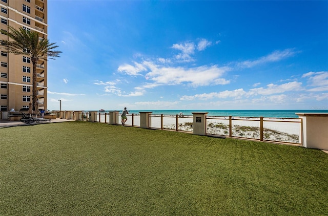 exterior space featuring a water view and a yard