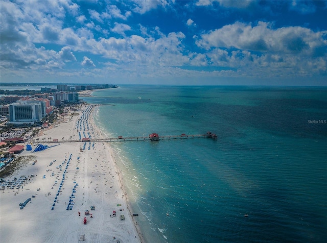 drone / aerial view with a water view and a beach view