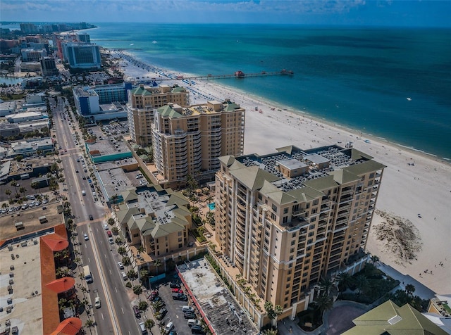 aerial view featuring a water view and a beach view