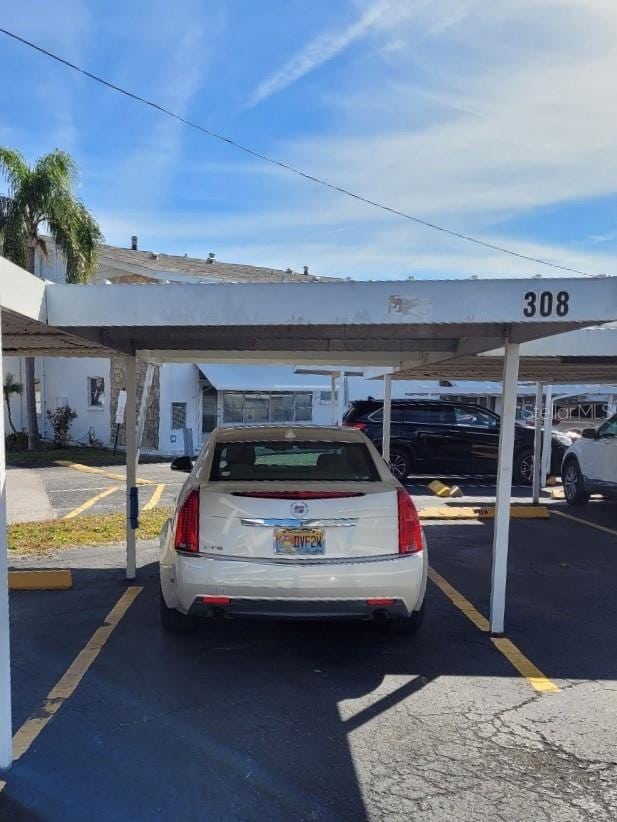 view of parking with a carport