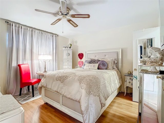 bedroom with ceiling fan and wood-type flooring