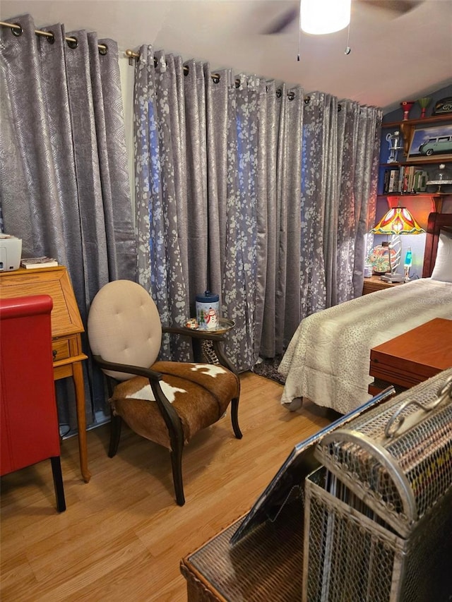 bedroom with hardwood / wood-style flooring and ceiling fan