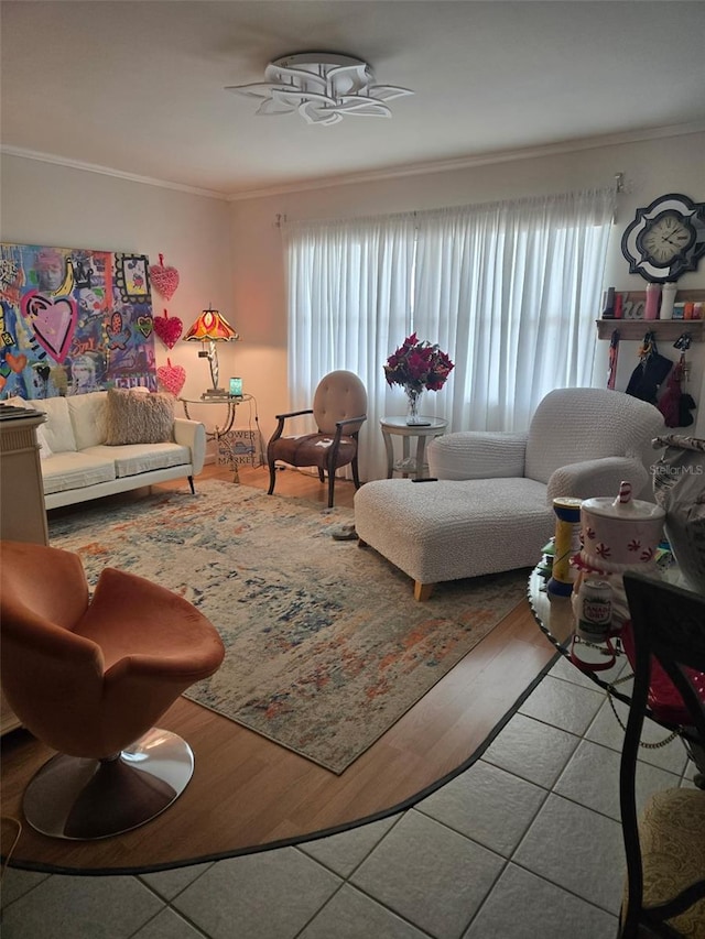 living room featuring ornamental molding and ceiling fan