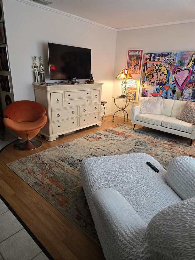 living room with ornamental molding and wood-type flooring