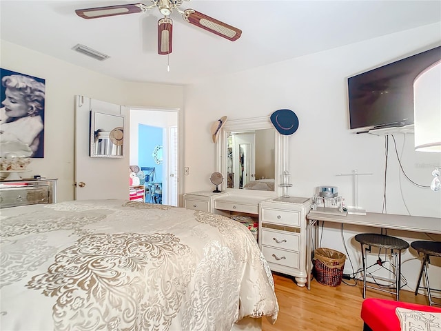 bedroom with ceiling fan and light wood-type flooring