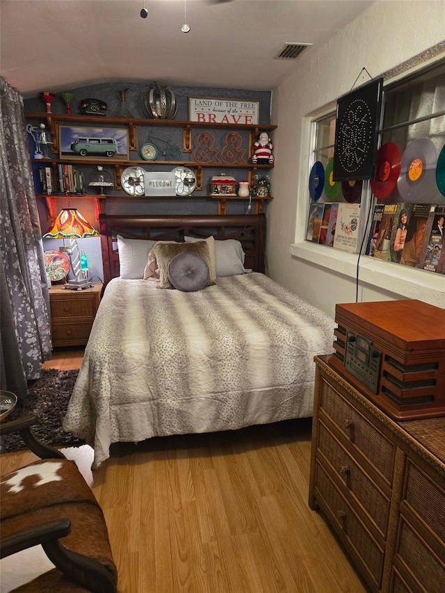 bedroom with light hardwood / wood-style floors