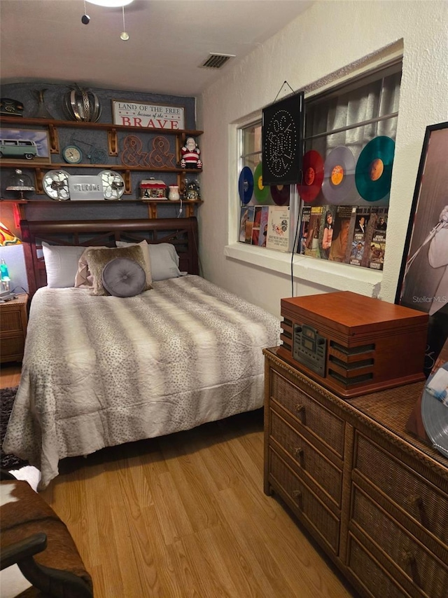 bedroom with light hardwood / wood-style floors