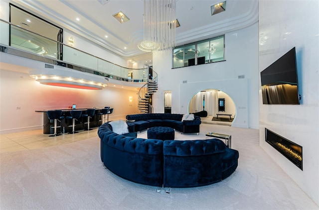 carpeted living room featuring a high ceiling