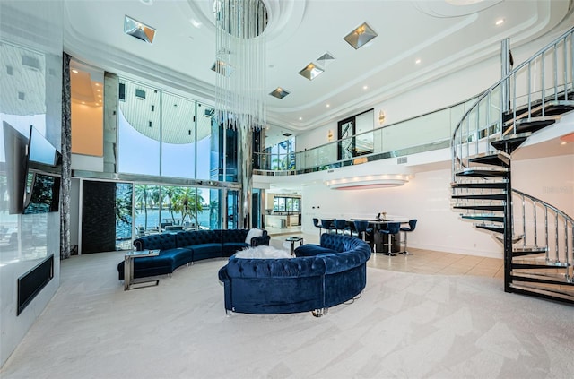 carpeted living room with a high ceiling and crown molding