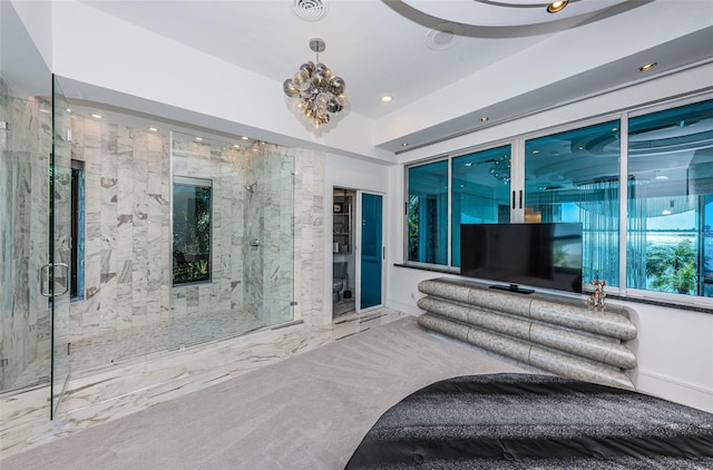 bedroom featuring light colored carpet and a notable chandelier