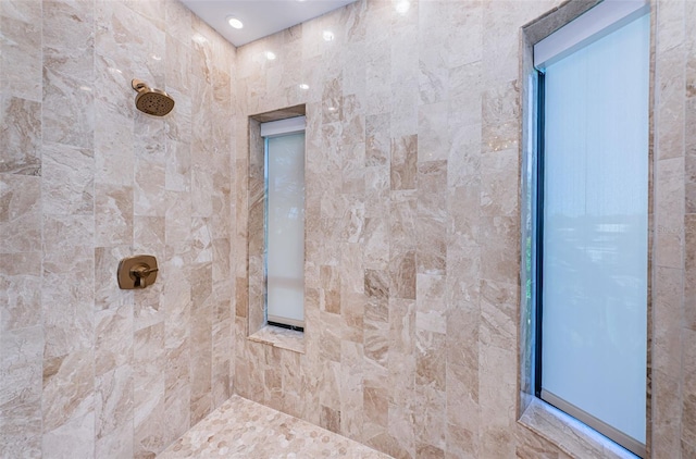 bathroom with tiled shower