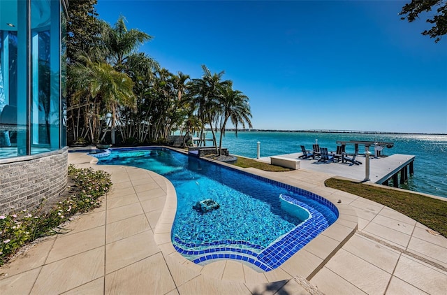 view of pool featuring a water view and a patio