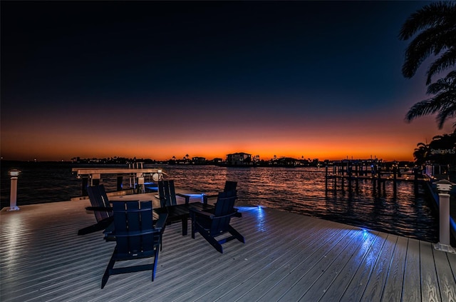 exterior space featuring a boat dock and a water view