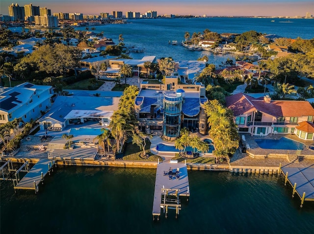 aerial view at dusk with a water view