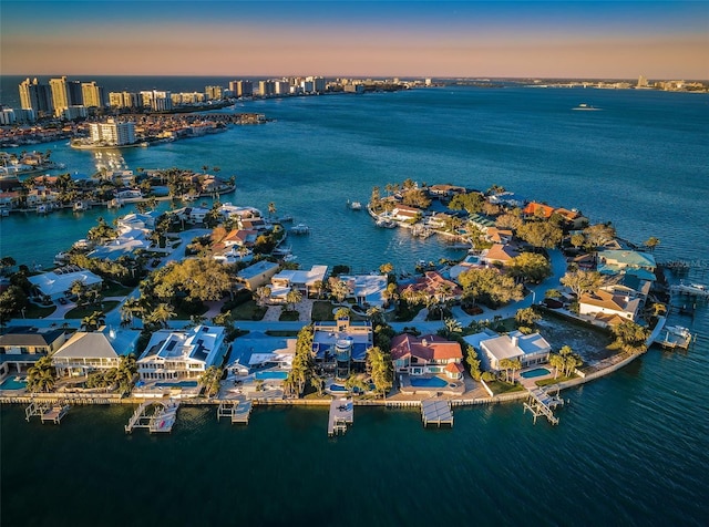 aerial view at dusk with a water view