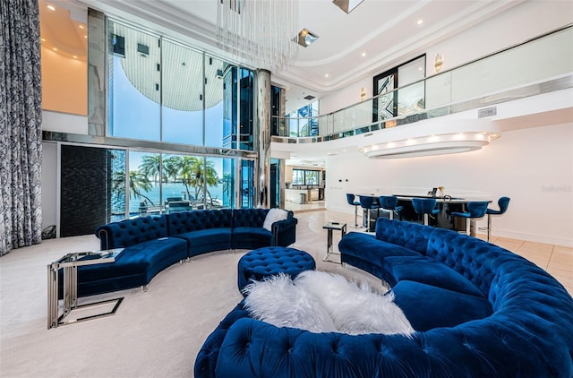 tiled living area featuring a high ceiling and visible vents