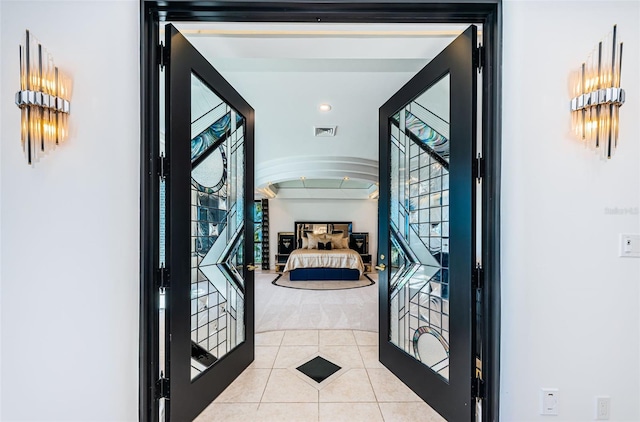 tiled foyer entrance featuring visible vents