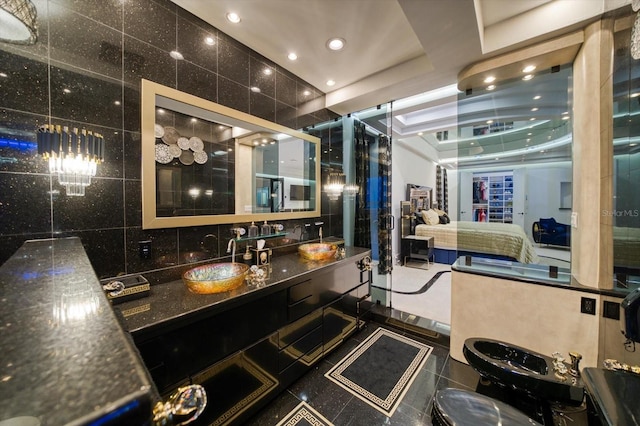 full bathroom featuring tasteful backsplash, recessed lighting, a shower with shower door, and vanity