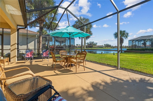 sunroom featuring a water view