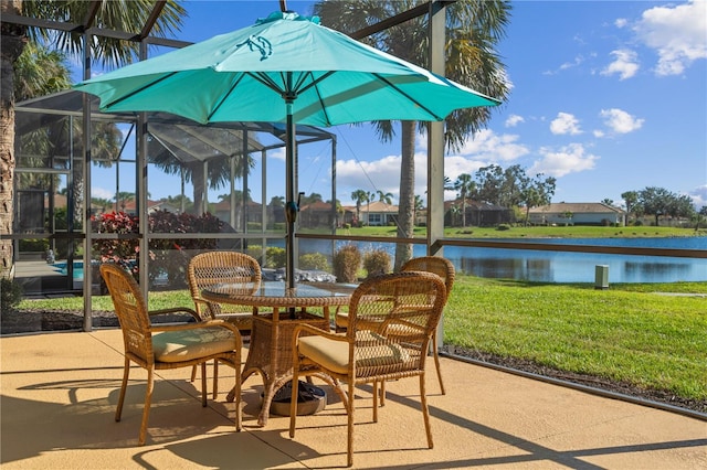 view of terrace with a water view and glass enclosure