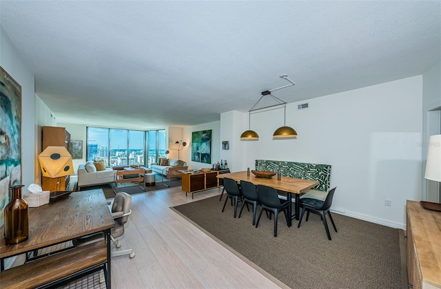 dining room with light hardwood / wood-style flooring