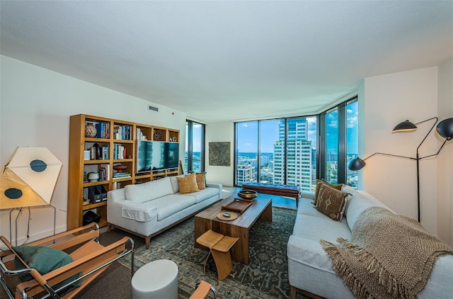 carpeted living room featuring a wall of windows