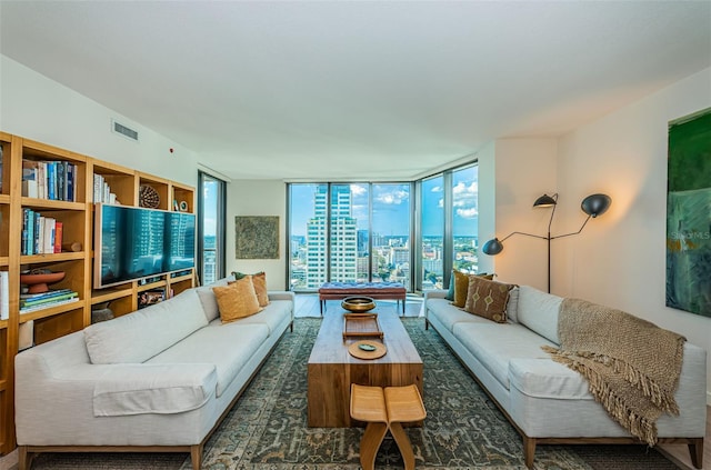 living room with dark hardwood / wood-style flooring and expansive windows