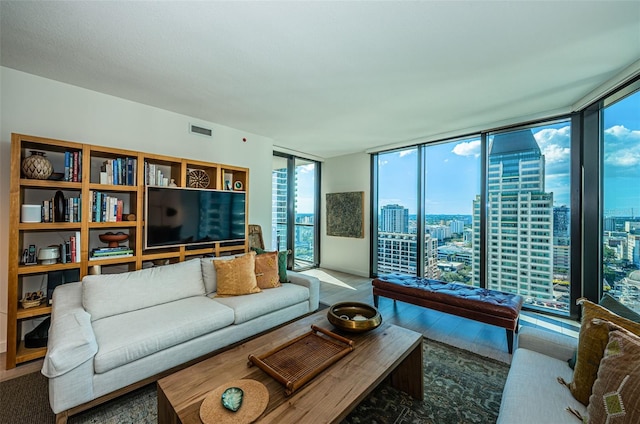 living room with floor to ceiling windows and wood-type flooring