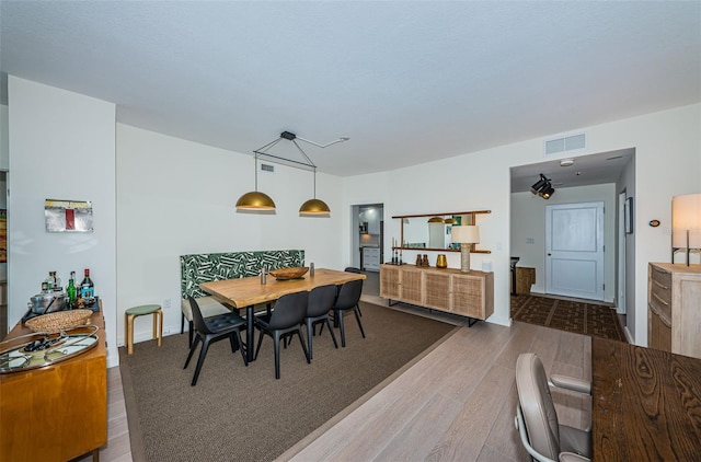 dining area with dark wood-type flooring