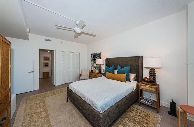 bedroom featuring a closet, ceiling fan, and light hardwood / wood-style flooring