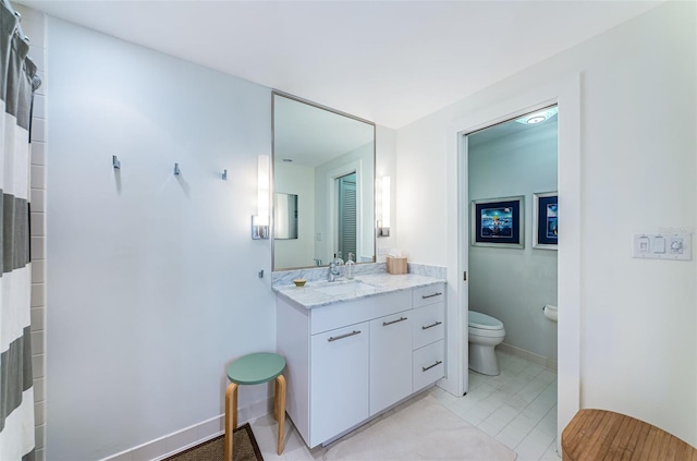 bathroom with toilet, tile flooring, and oversized vanity