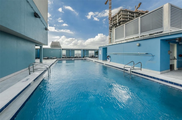 view of swimming pool with a patio