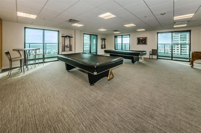 game room with carpet floors, plenty of natural light, pool table, and a drop ceiling