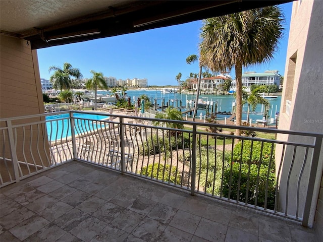 balcony featuring a water view