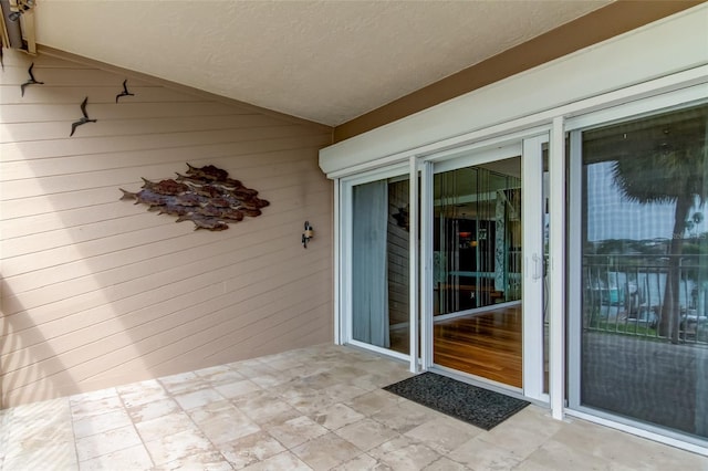 doorway to property featuring a patio