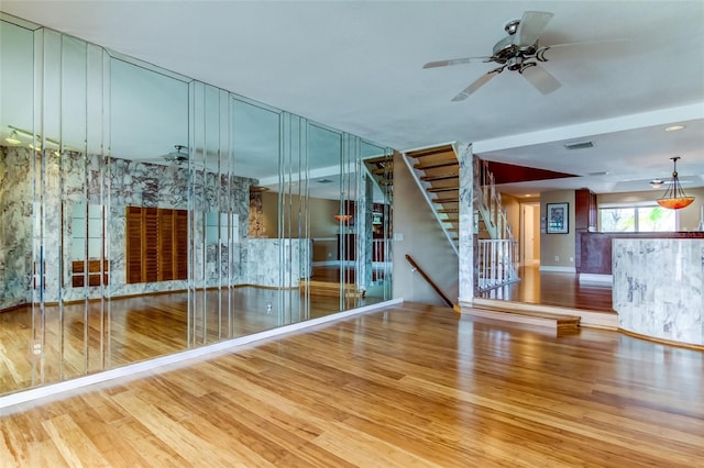 unfurnished room with light hardwood / wood-style floors and ceiling fan