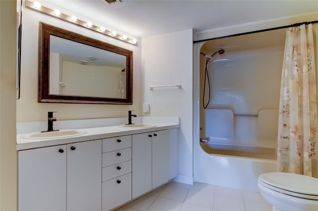 full bathroom featuring double sink vanity, tile flooring, shower / tub combo with curtain, and toilet