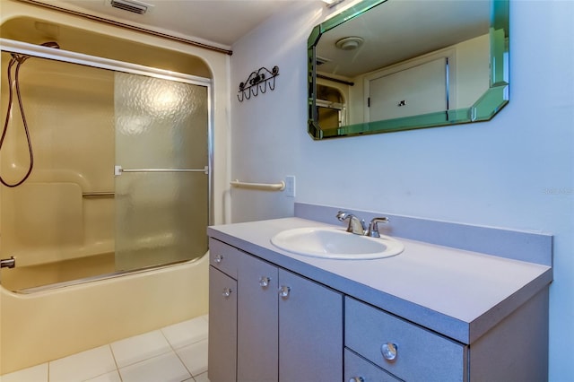 bathroom with shower / bath combination with glass door, vanity with extensive cabinet space, and tile flooring