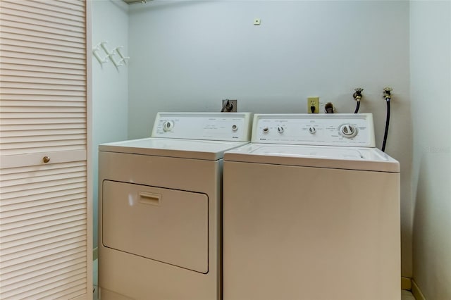 laundry area with hookup for a washing machine, electric dryer hookup, and washing machine and dryer