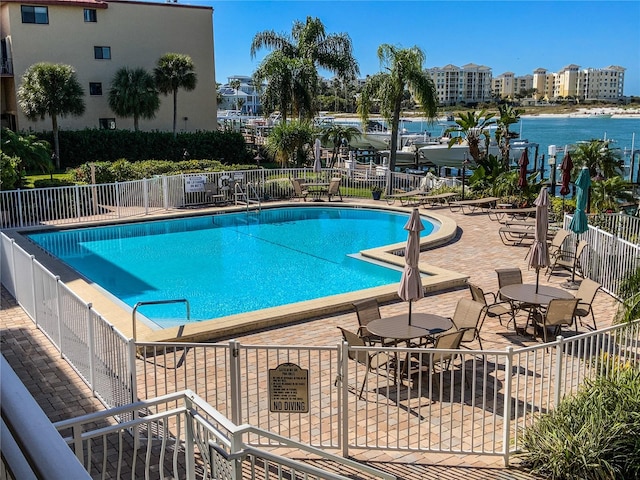 view of swimming pool with a patio