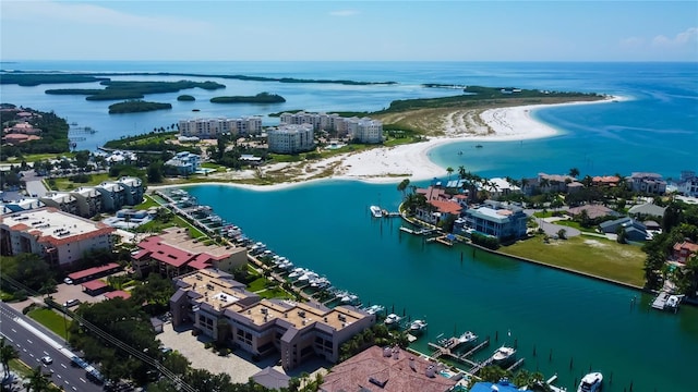 bird's eye view featuring a water view and a view of the beach