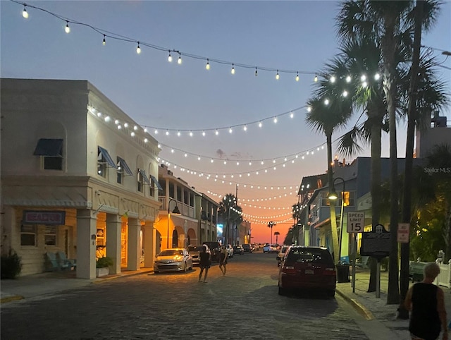 view of outdoor building at dusk