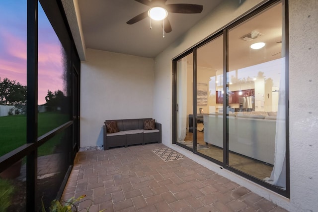 sunroom / solarium with ceiling fan