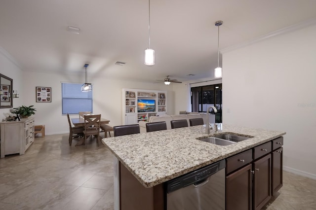 kitchen with stainless steel dishwasher, ceiling fan, a center island with sink, hanging light fixtures, and sink