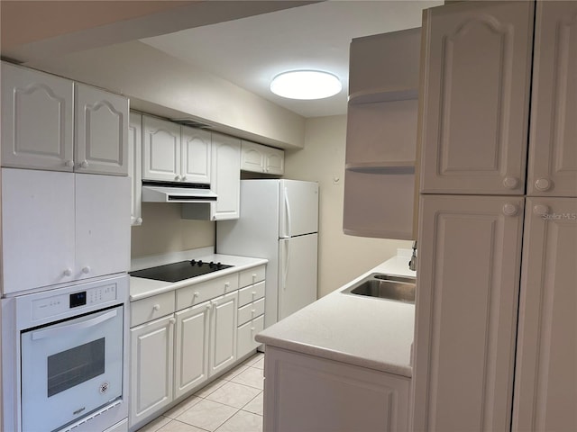 kitchen with open shelves, a sink, white appliances, light countertops, and extractor fan