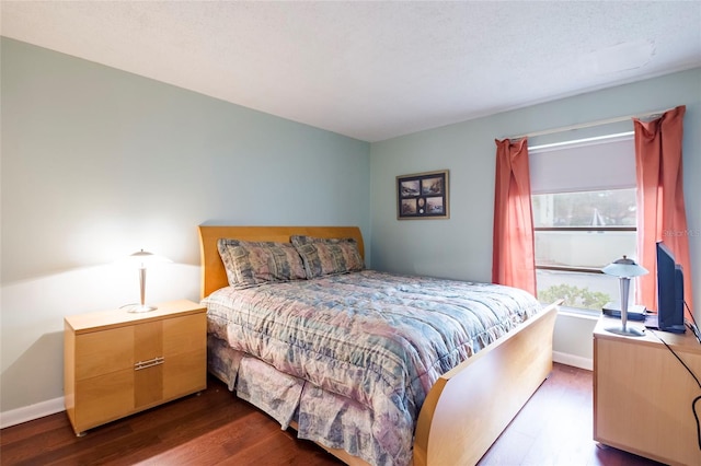 bedroom featuring dark wood-type flooring