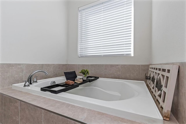 bathroom with tiled tub